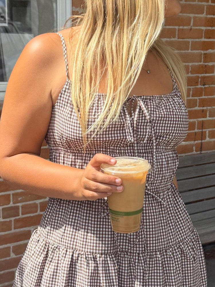 Latte on a wooden cafe table